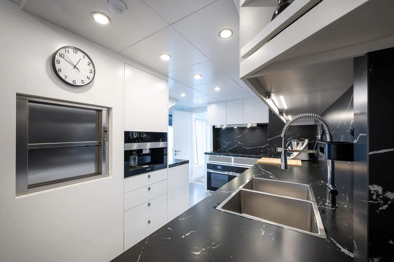 The yacht's galley features sleek, modern design with high-end appliances and ample counter space. aboard NUMARINE 37XP#22 Yacht for Sale