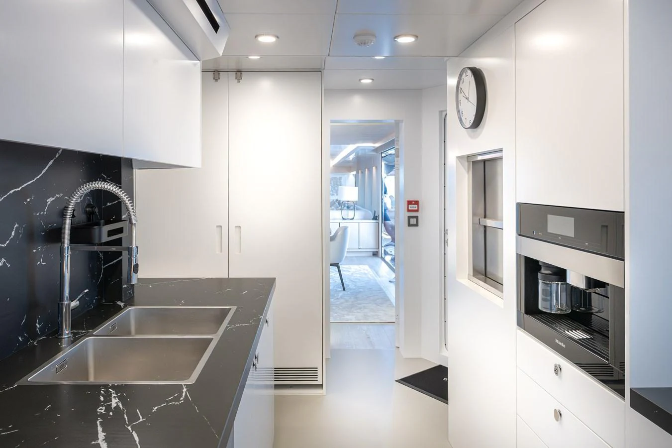 A sleek and modern galley with high-end appliances and stylish finishes. aboard NUMARINE 37XP#22 Yacht for Sale