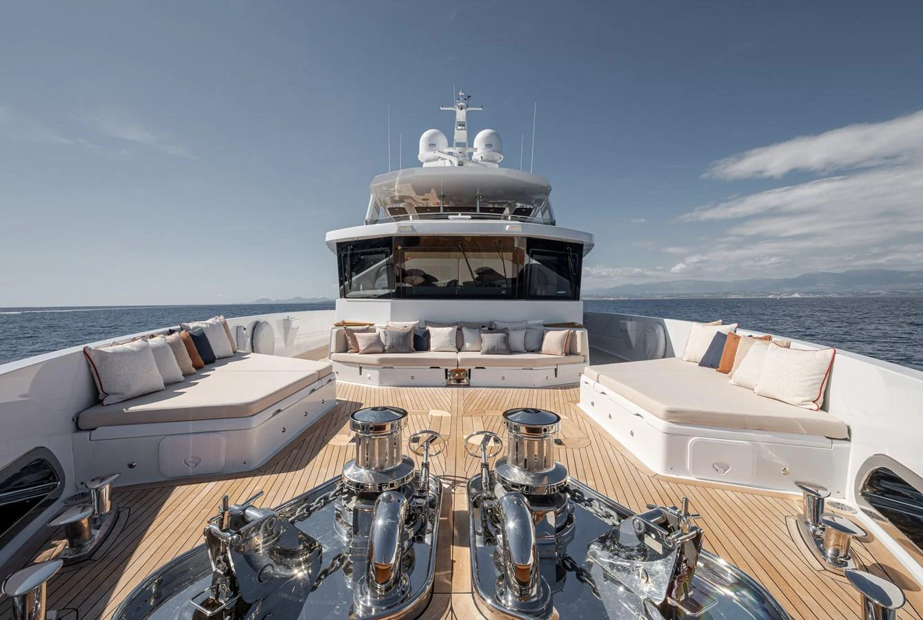 The foredeck features luxurious sunpads and seating areas with a stunning ocean backdrop. aboard NUMARINE 37XP#22 Yacht for Sale