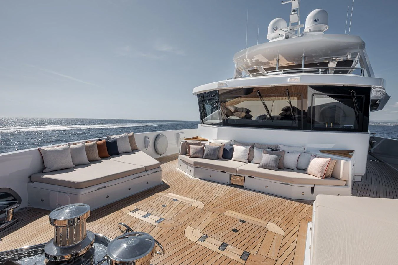 The aft deck features luxurious seating with plush cushions, offering a perfect spot to relax and enjoy the ocean view. aboard NUMARINE 37XP#22 Yacht for Sale