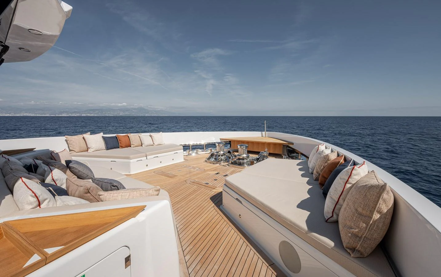 The foredeck offers a spacious and luxurious lounging area with plush seating and stunning ocean views. aboard NUMARINE 37XP#22 Yacht for Sale