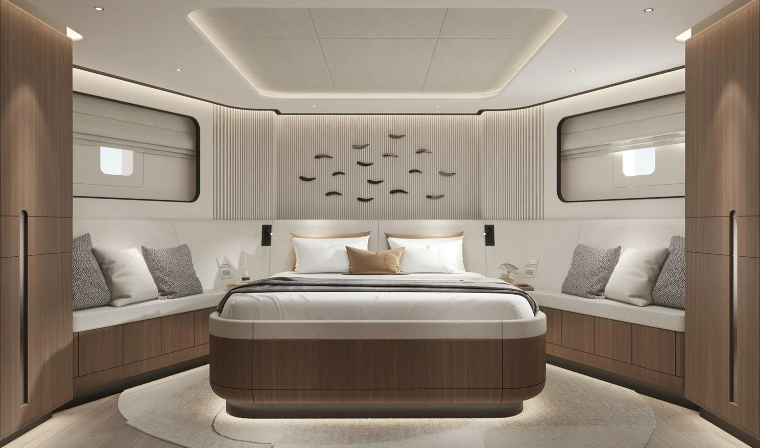 The master stateroom features a luxurious bed with elegant wood finishes and ample natural light. aboard B77 Yacht for Sale