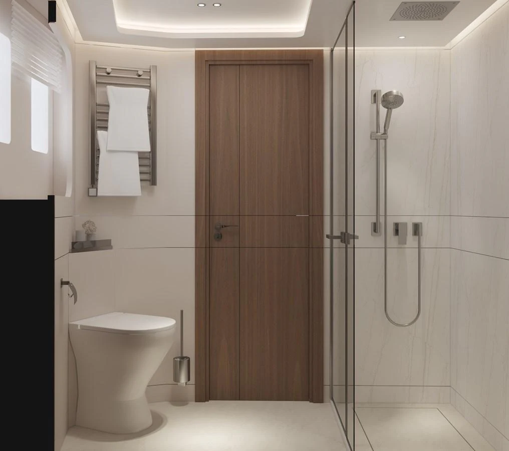The yacht's bathroom features a sleek, modern design with a glass-enclosed shower and elegant fixtures. aboard B77 Yacht for Sale