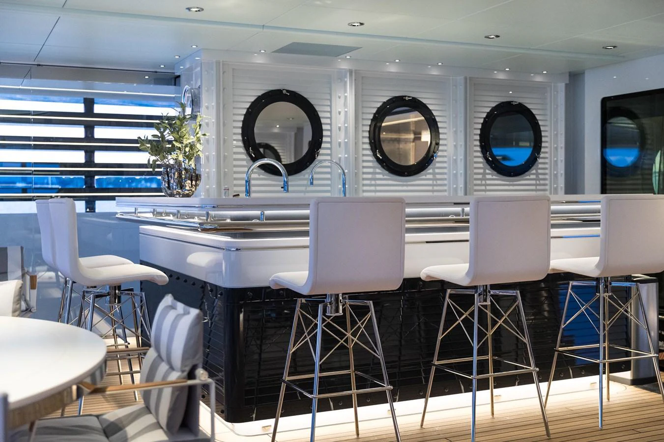 The yacht's interior bar area features modern seating and stylish decor, perfect for socializing. aboard SCOUT Yacht for Sale