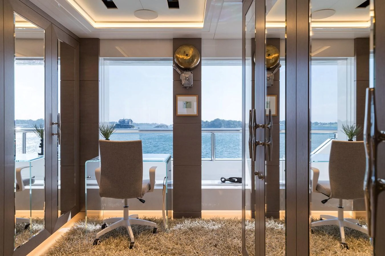 A serene office space with a stunning ocean view, featuring modern furnishings and ample natural light. aboard SCOUT Yacht for Sale