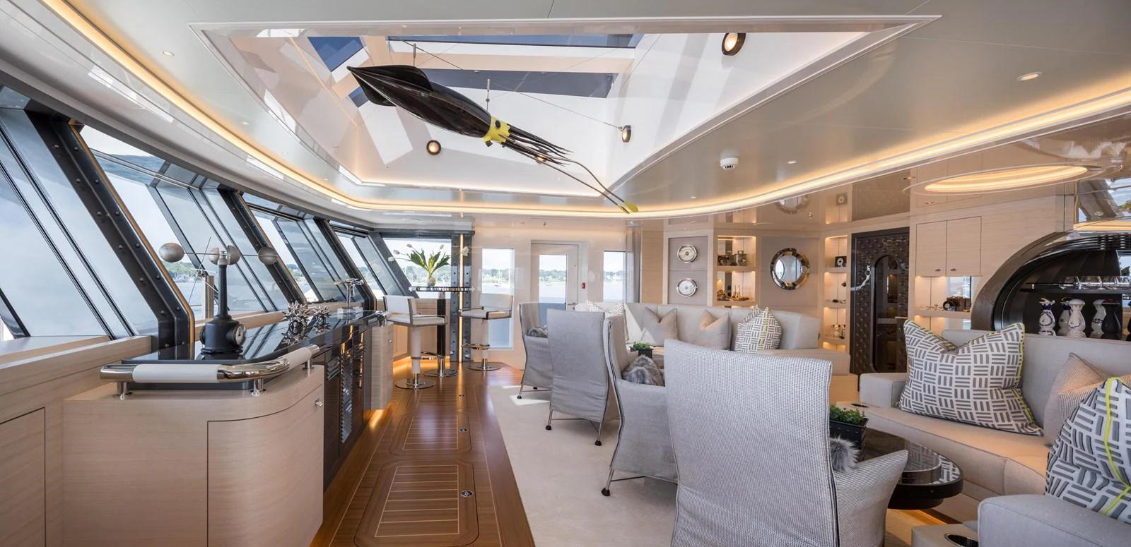 The salon features a spacious and luxurious seating area with modern decor and ample natural light. aboard SCOUT Yacht for Sale