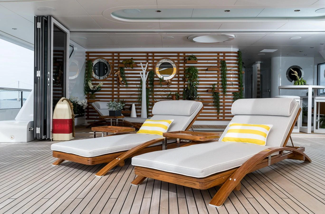 The sundeck features stylish lounge chairs and a modern, inviting ambiance. aboard SCOUT Yacht for Sale