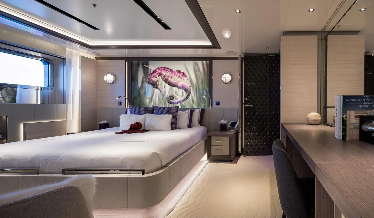 The stateroom features a luxurious bed, modern decor, and ample natural light. aboard SCOUT Yacht for Sale