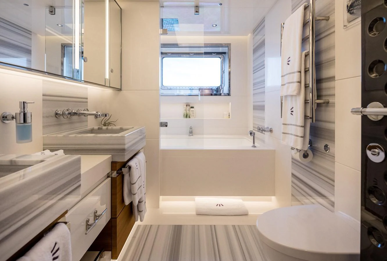 A luxurious yacht bathroom featuring modern fixtures and elegant design. aboard SCOUT Yacht for Sale