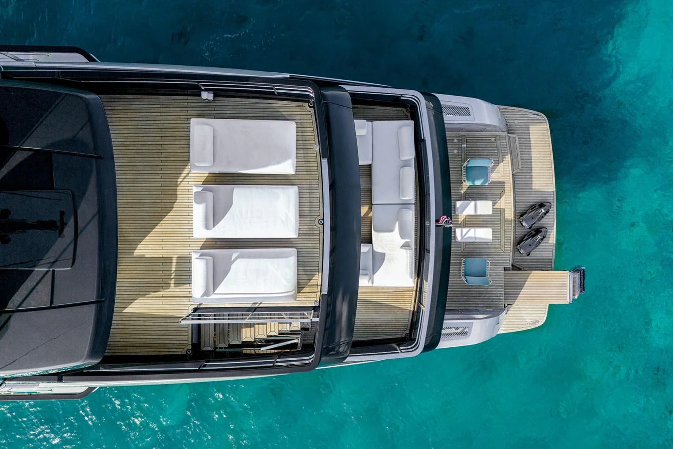 The sundeck offers a luxurious space for relaxation with sun loungers and a clear view of the surrounding waters. aboard RIVA 130/02 Yacht for Sale