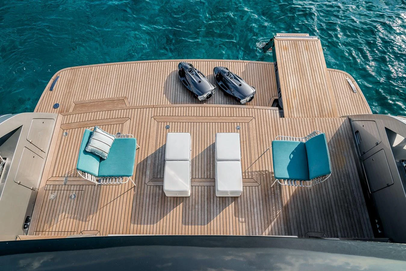 The aft deck features a spacious lounging area with sunbeds and direct access to the water. aboard RIVA 130/02 Yacht for Sale