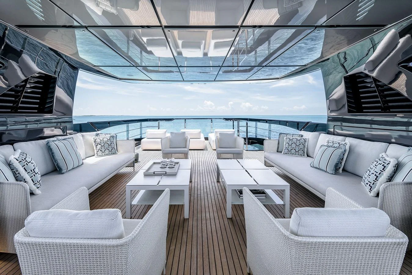 The aft deck offers a luxurious and spacious seating area with stunning ocean views. aboard RIVA 130/02 Yacht for Sale