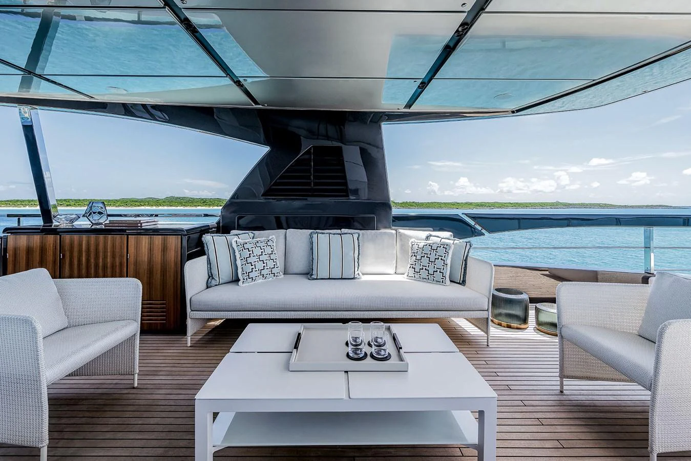 The aft deck offers a stylish and comfortable outdoor seating area with a stunning view of the water. aboard RIVA 130/02 Yacht for Sale