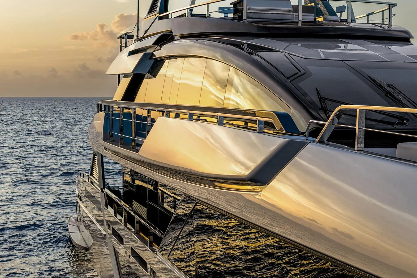 The yacht's sleek exterior reflects the golden hues of the sunset over the tranquil sea. aboard RIVA 130/02 Yacht for Sale