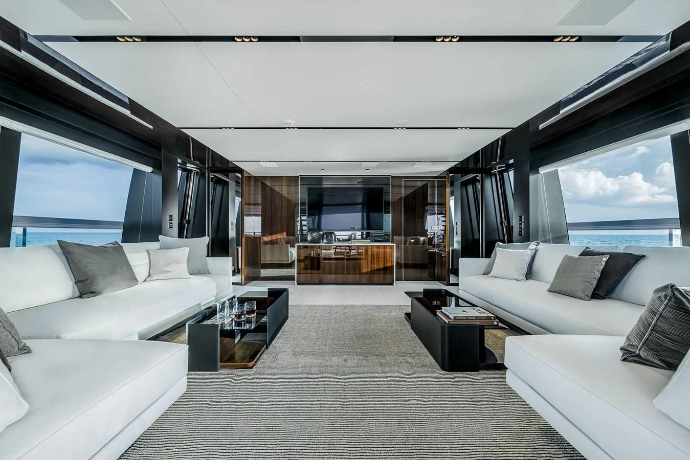The salon features modern furnishings with panoramic views and luxurious seating. aboard RIVA 130/02 Yacht for Sale