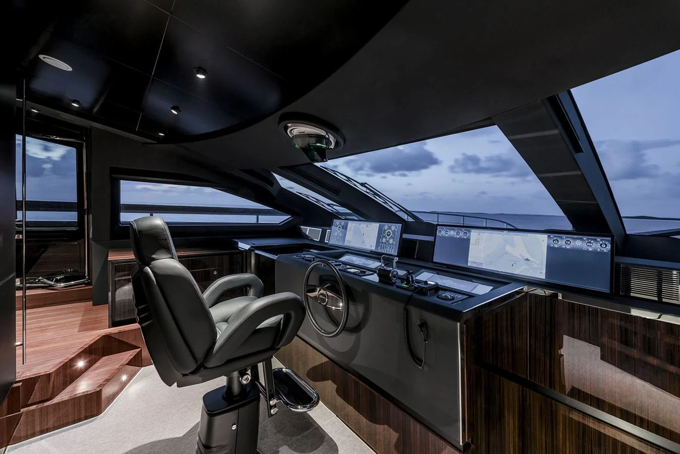 The sleek and modern helm station offers advanced navigation technology and panoramic views. aboard RIVA 130/02 Yacht for Sale