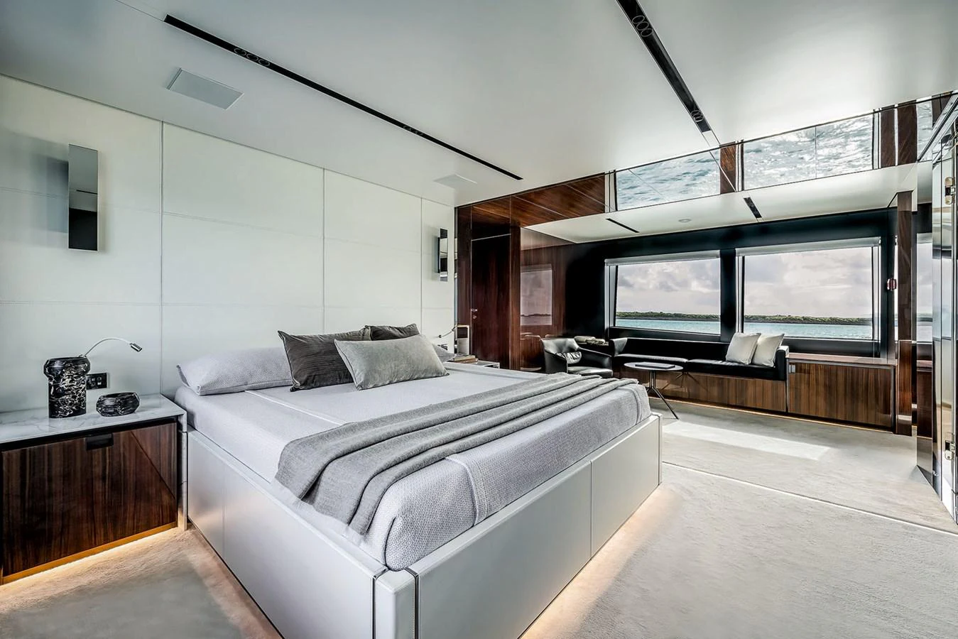 The master stateroom features a luxurious bed with elegant decor and ample natural light. aboard RIVA 130/02 Yacht for Sale