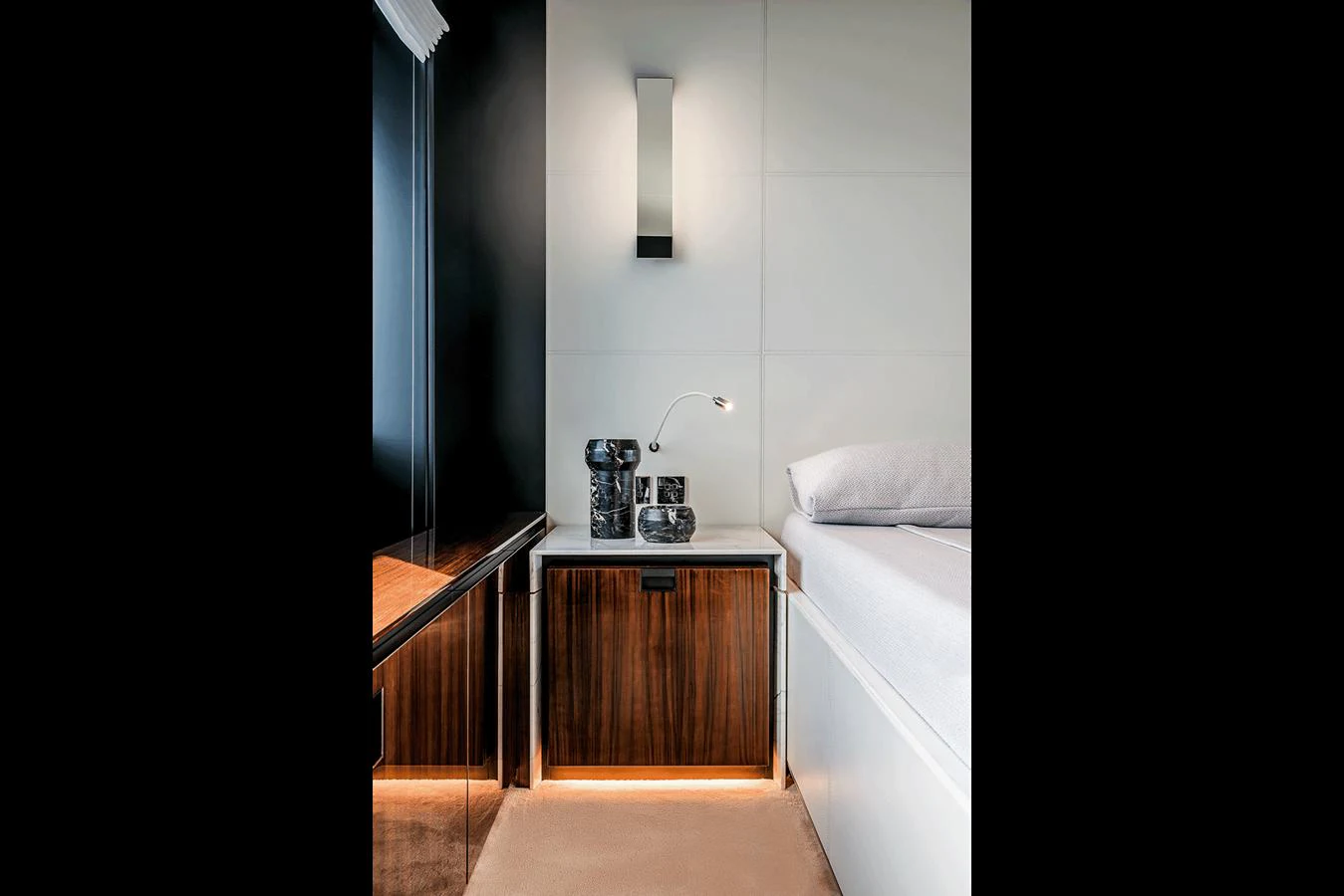 A luxurious stateroom featuring elegant wood cabinetry and modern lighting. aboard RIVA 130/02 Yacht for Sale
