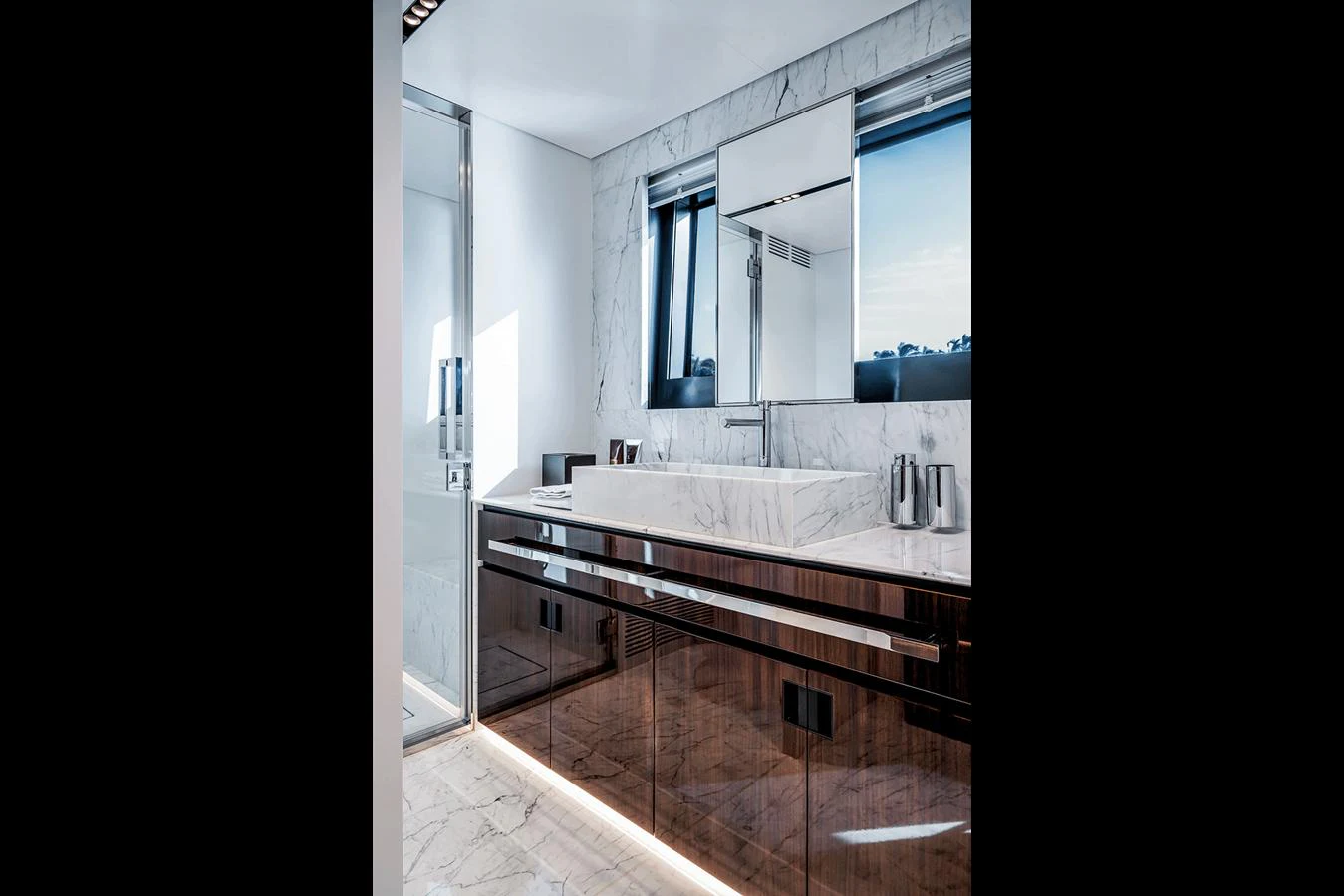 The yacht's bathroom features sleek, modern design with marble accents and high-end fixtures. aboard RIVA 130/02 Yacht for Sale