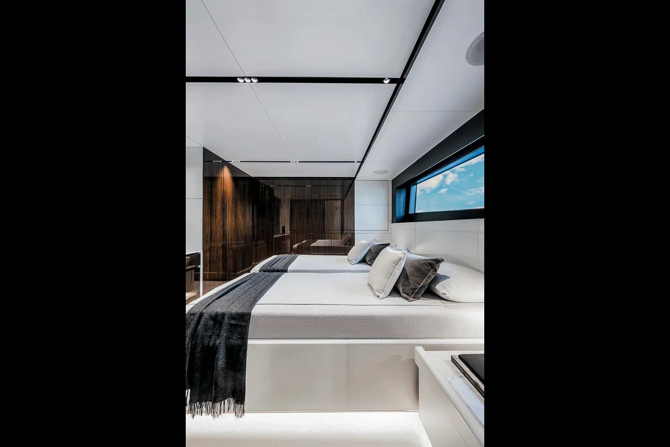 The stateroom features a modern design with sleek lines and luxurious bedding. aboard RIVA 130/02 Yacht for Sale