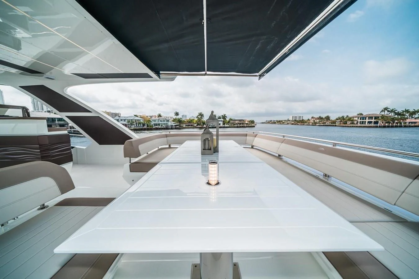 The aft deck features a spacious dining area with a sleek, modern table and comfortable seating, perfect for alfresco meals. aboard GALEON Yacht for Sale