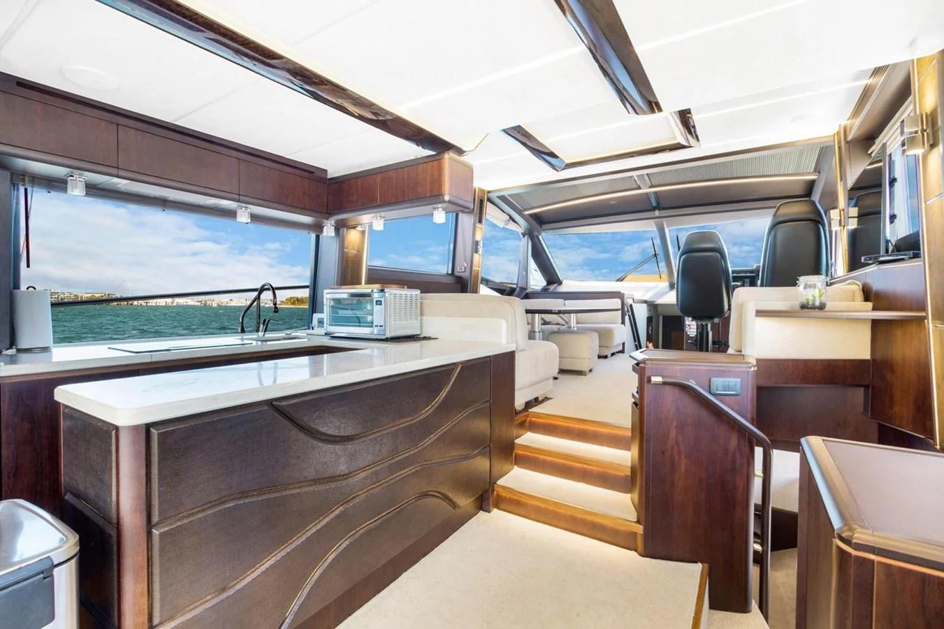 The galley features modern design elements with ample natural light and stunning water views. aboard GALEON Yacht for Sale