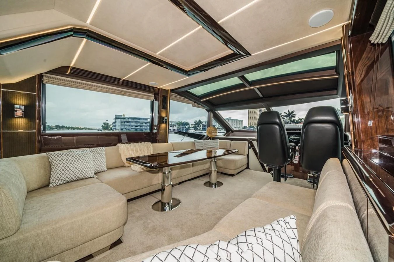 The salon features plush seating and expansive windows for a luxurious and comfortable atmosphere. aboard GALEON Yacht for Sale