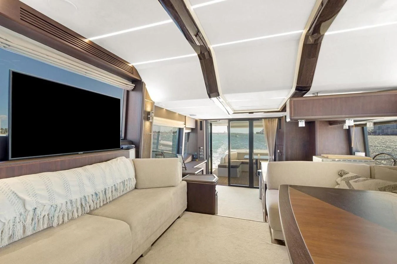 The salon offers a spacious and luxurious seating area with large windows providing stunning views. aboard GALEON Yacht for Sale
