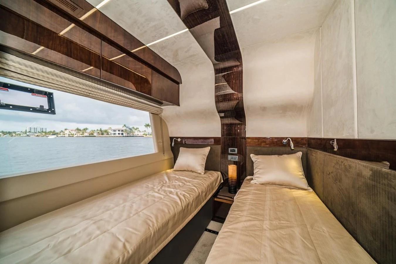 The twin stateroom offers a cozy and elegant retreat with a scenic view of the water. aboard GALEON Yacht for Sale