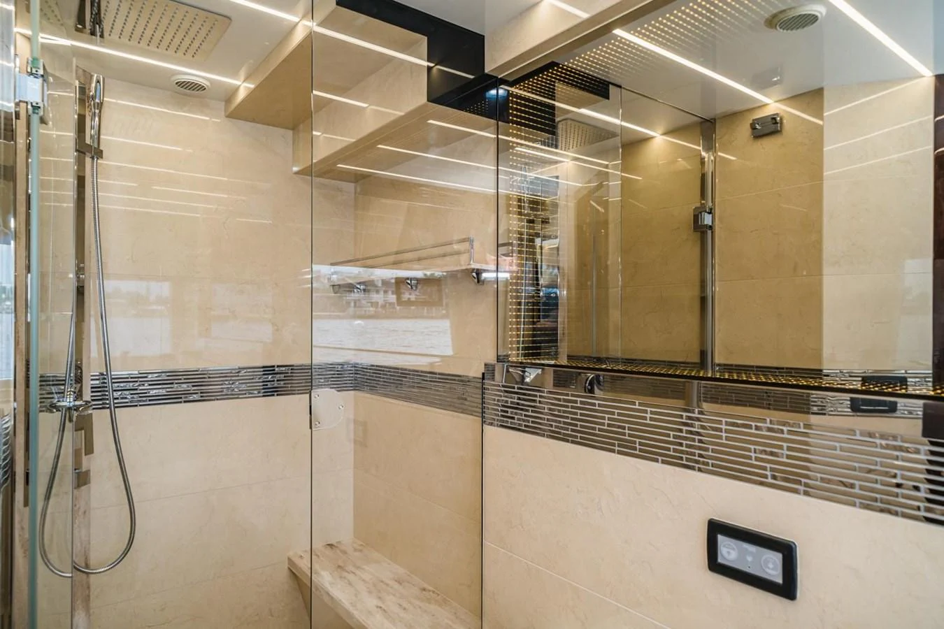The yacht's bathroom features a modern, luxurious shower with sleek fixtures and elegant tiling. aboard GALEON Yacht for Sale