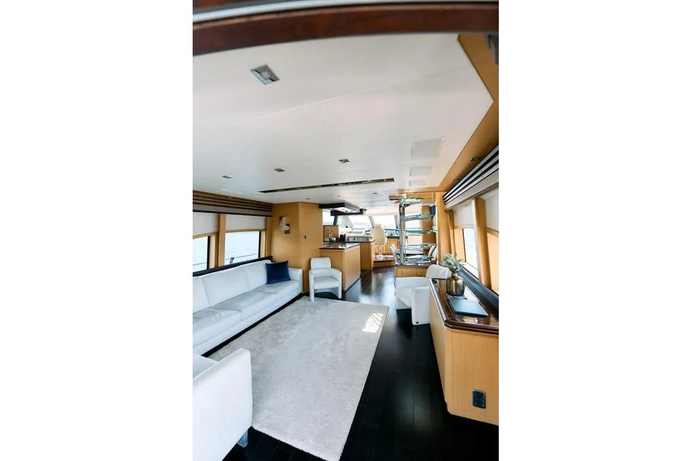 The yacht's salon features a spacious and modern design with ample seating and natural light. aboard MARQUIS 720 Yacht for Sale