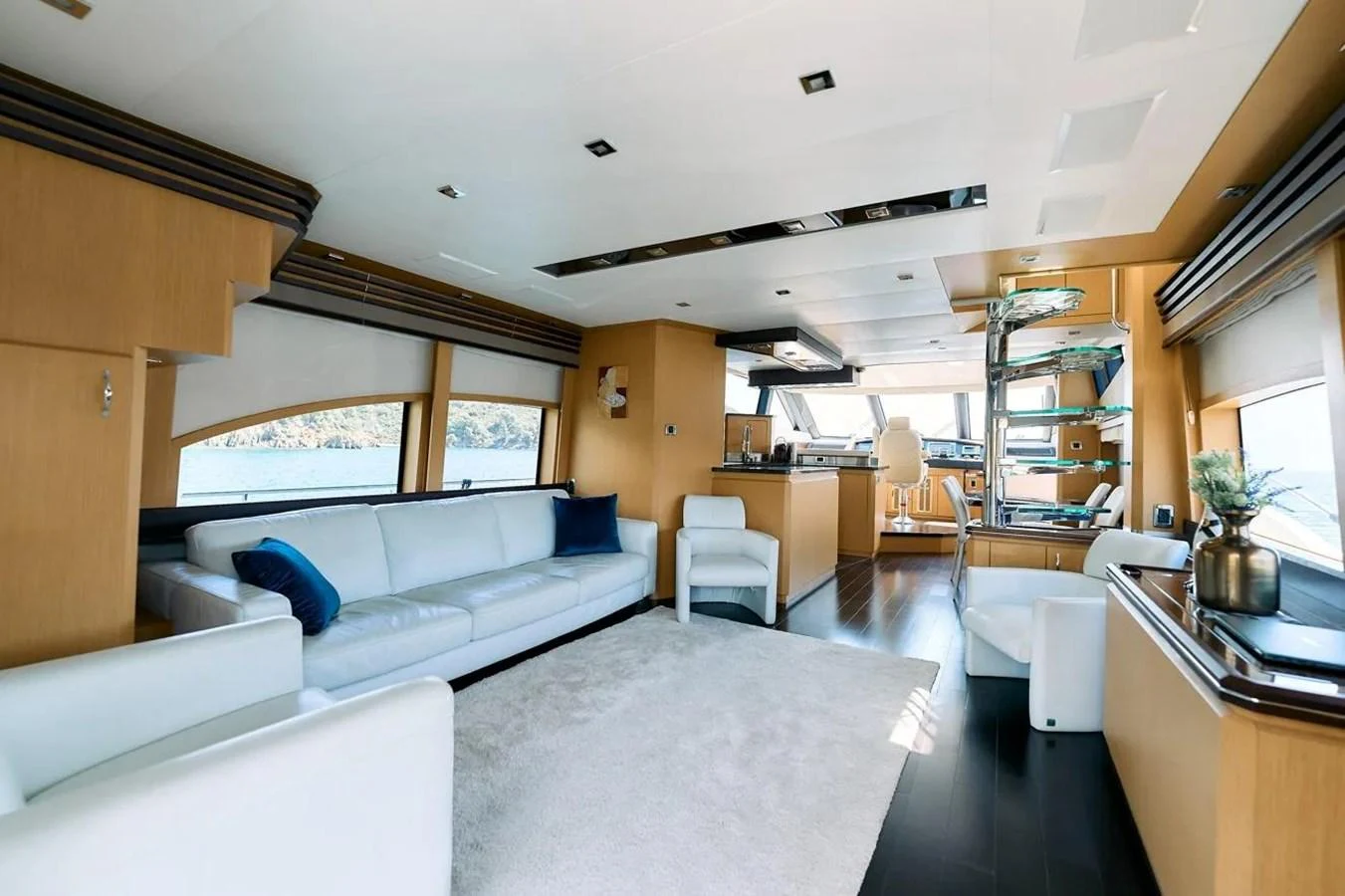 The salon features a spacious and modern design with ample seating and natural light. aboard MARQUIS 720 Yacht for Sale