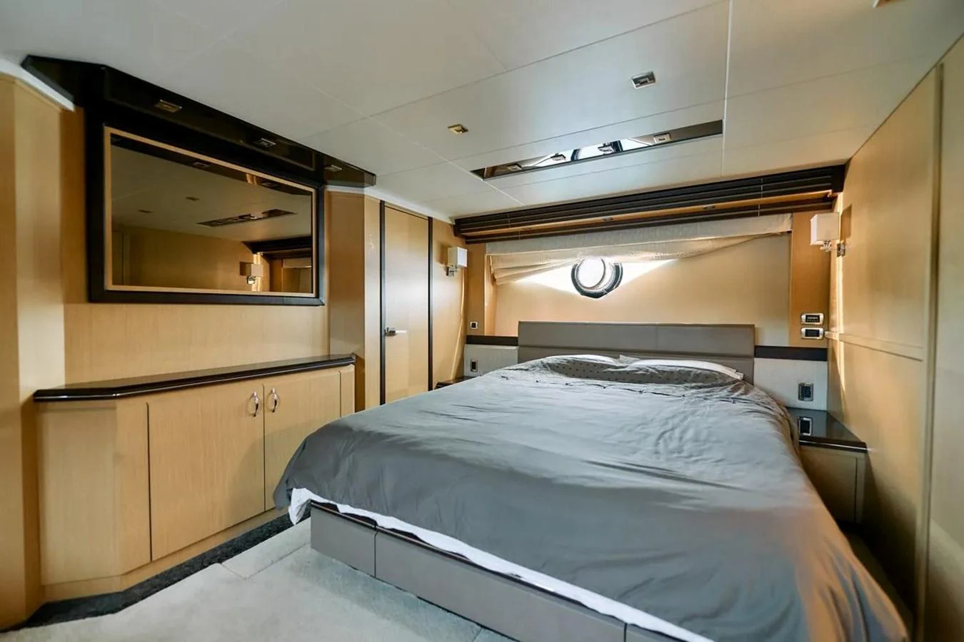 The master stateroom features a spacious bed with modern furnishings and ample natural light. aboard MARQUIS 720 Yacht for Sale