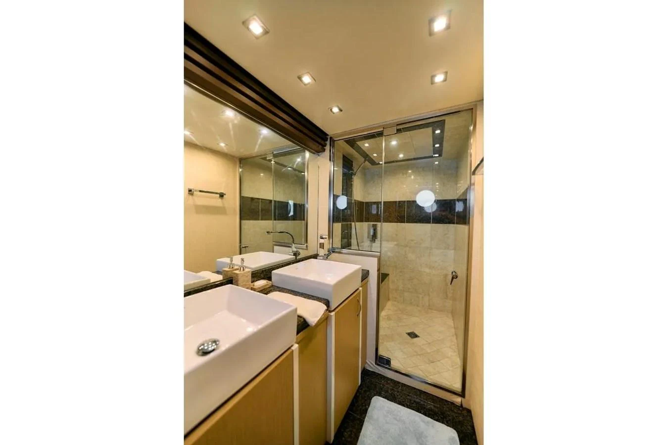 The yacht's bathroom features modern fixtures and a spacious shower area. aboard MARQUIS 720 Yacht for Sale
