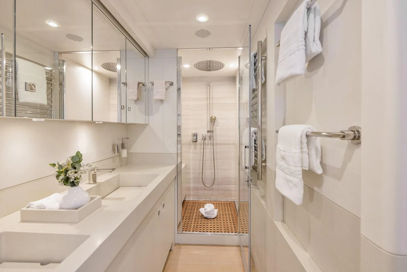 The yacht's bathroom features a sleek design with modern fixtures and ample lighting. aboard VANADIS Yacht for Sale