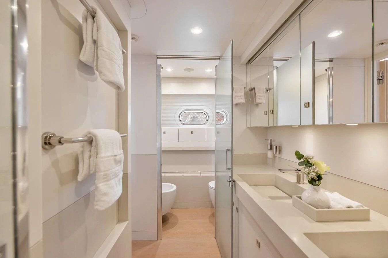 The yacht's bathroom features a modern design with sleek fixtures and ample lighting. aboard VANADIS Yacht for Sale