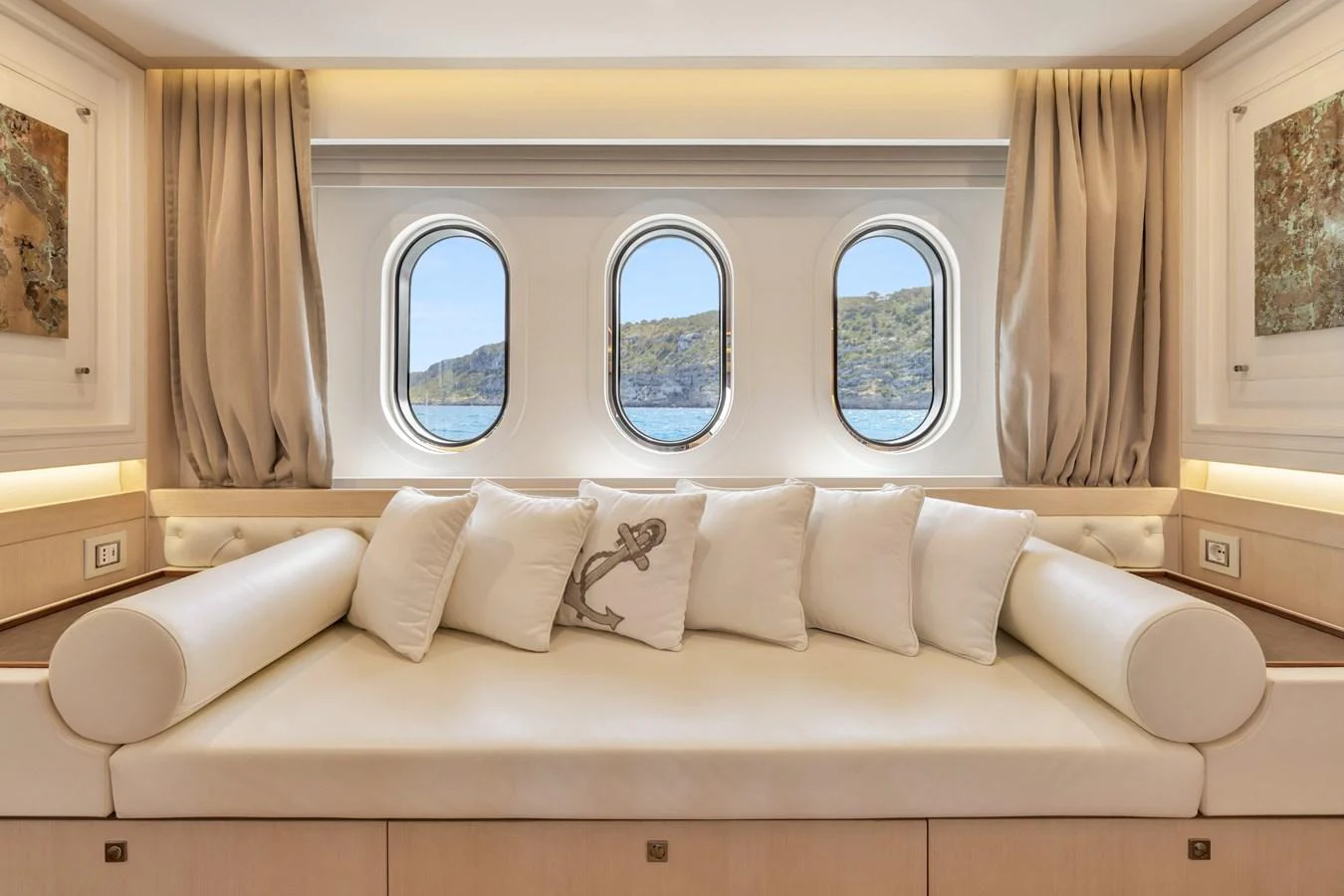 The salon features a comfortable seating area with large windows offering scenic views. aboard VANADIS Yacht for Sale