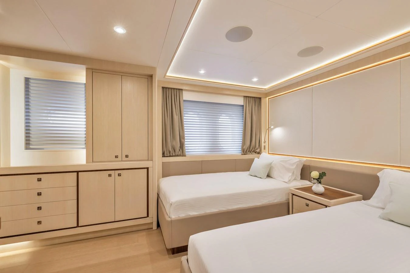 The guest stateroom features twin beds and elegant, modern decor. aboard VANADIS Yacht for Sale