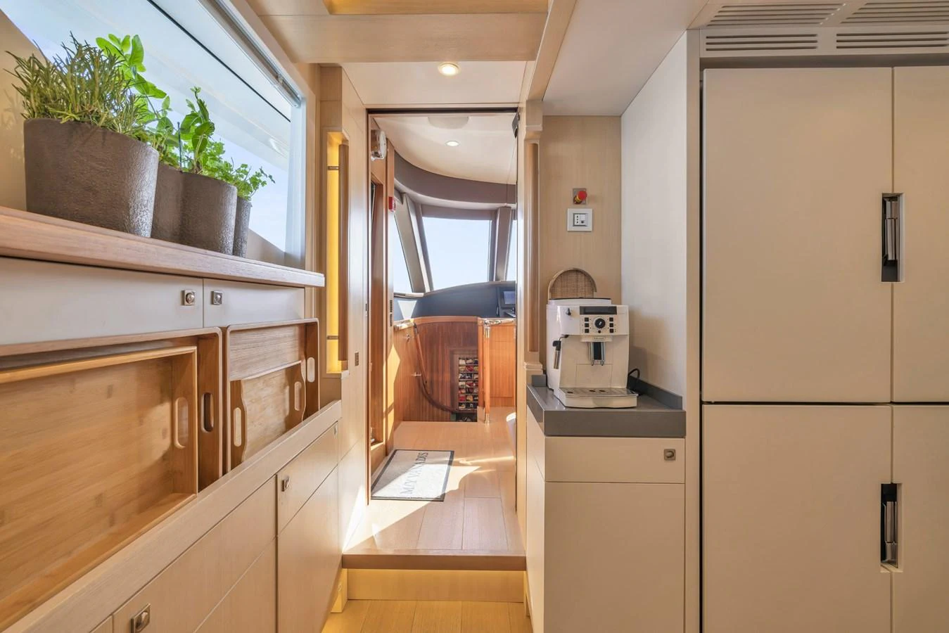 The galley features modern appliances and ample storage, leading to a bright and inviting helm area. aboard VANADIS Yacht for Sale