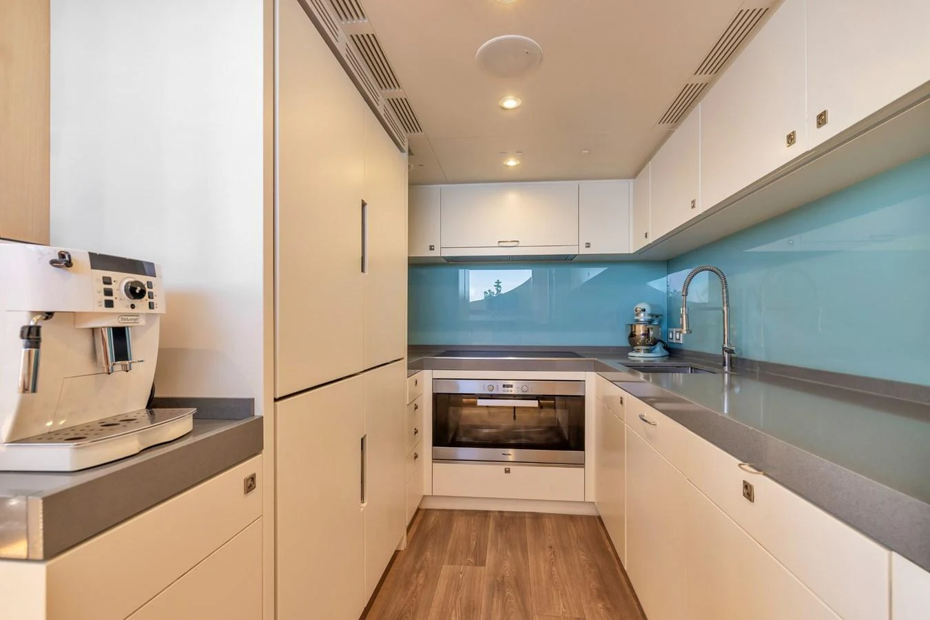 The galley features modern appliances and sleek design for a luxurious cooking experience. aboard VANADIS Yacht for Sale
