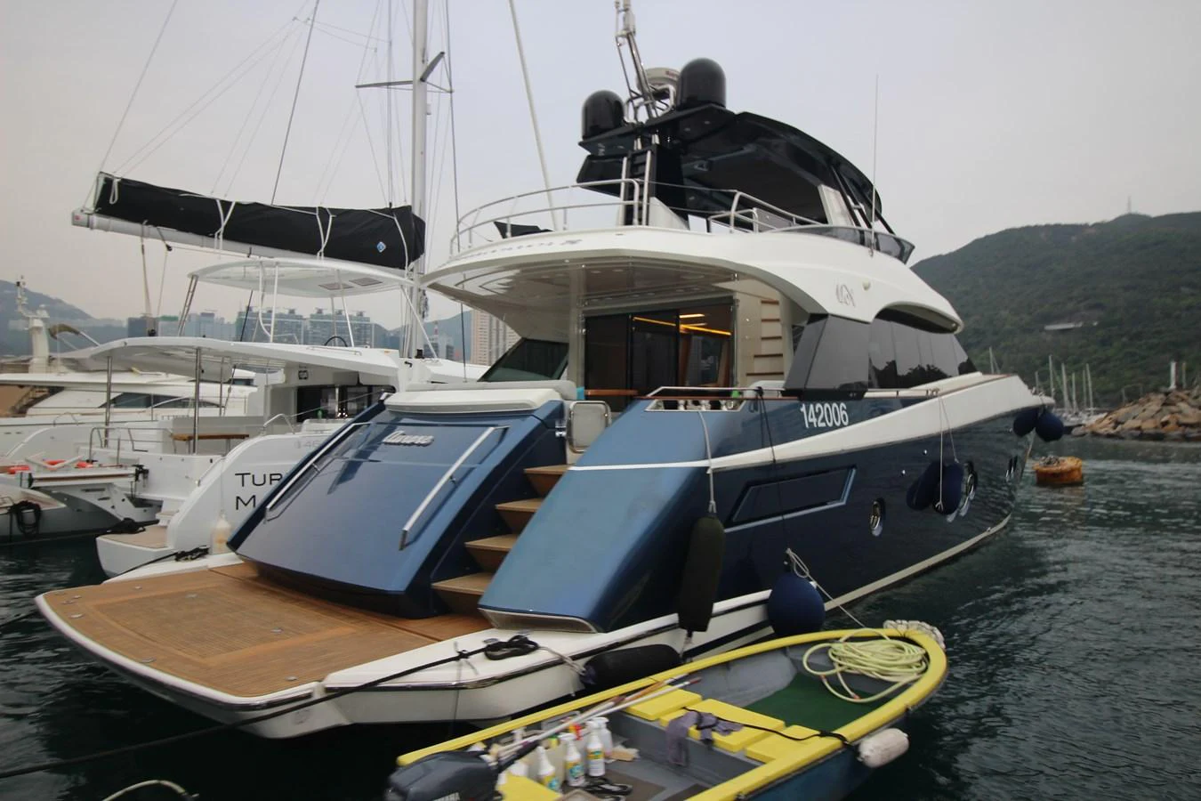 The yacht's aft deck features a spacious swim platform and elegant steps leading to the main deck. aboard AURORA Yacht for Sale