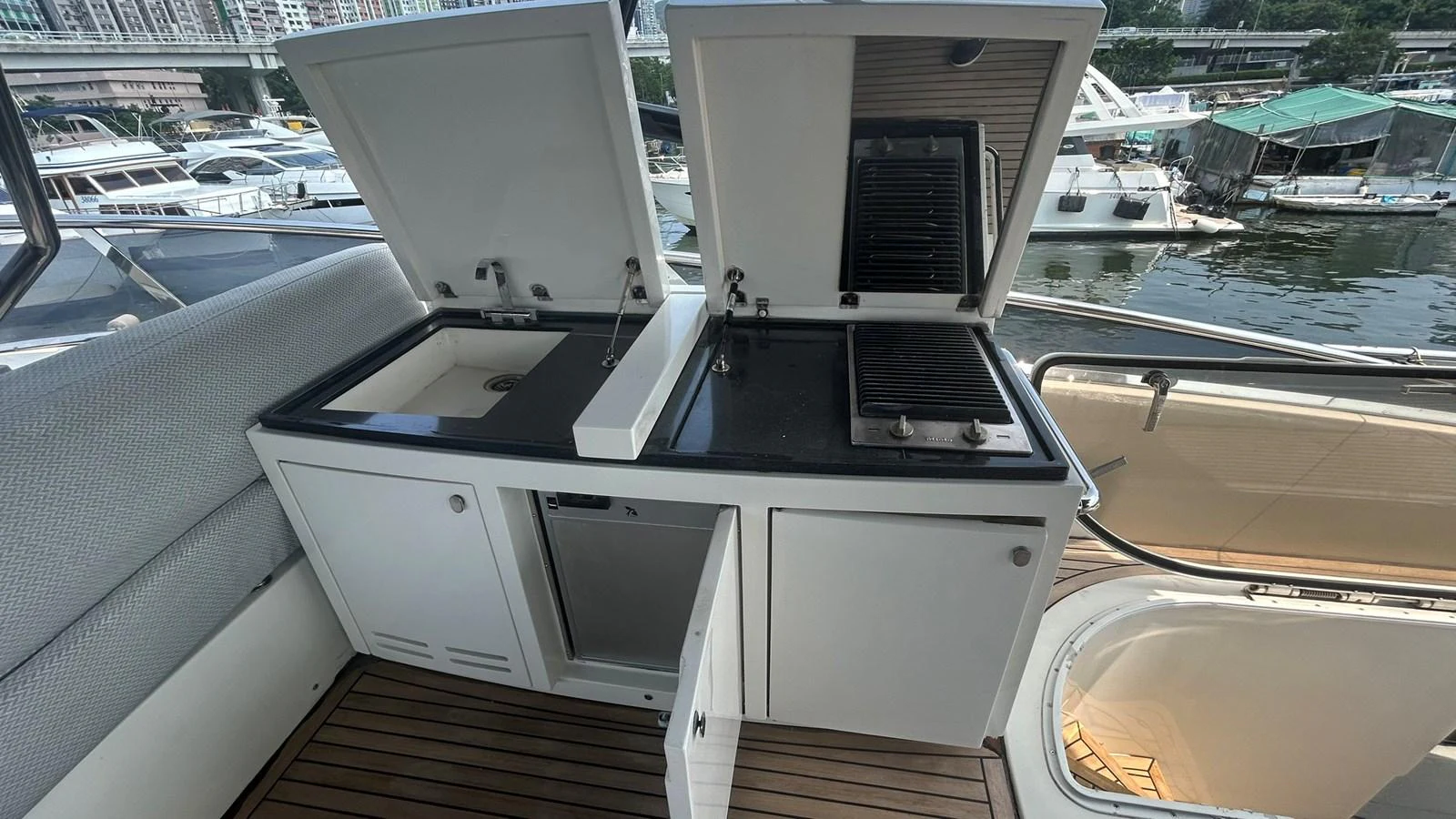 The yacht features a well-equipped outdoor galley with a sink and grill, perfect for alfresco dining. aboard AURORA Yacht for Sale