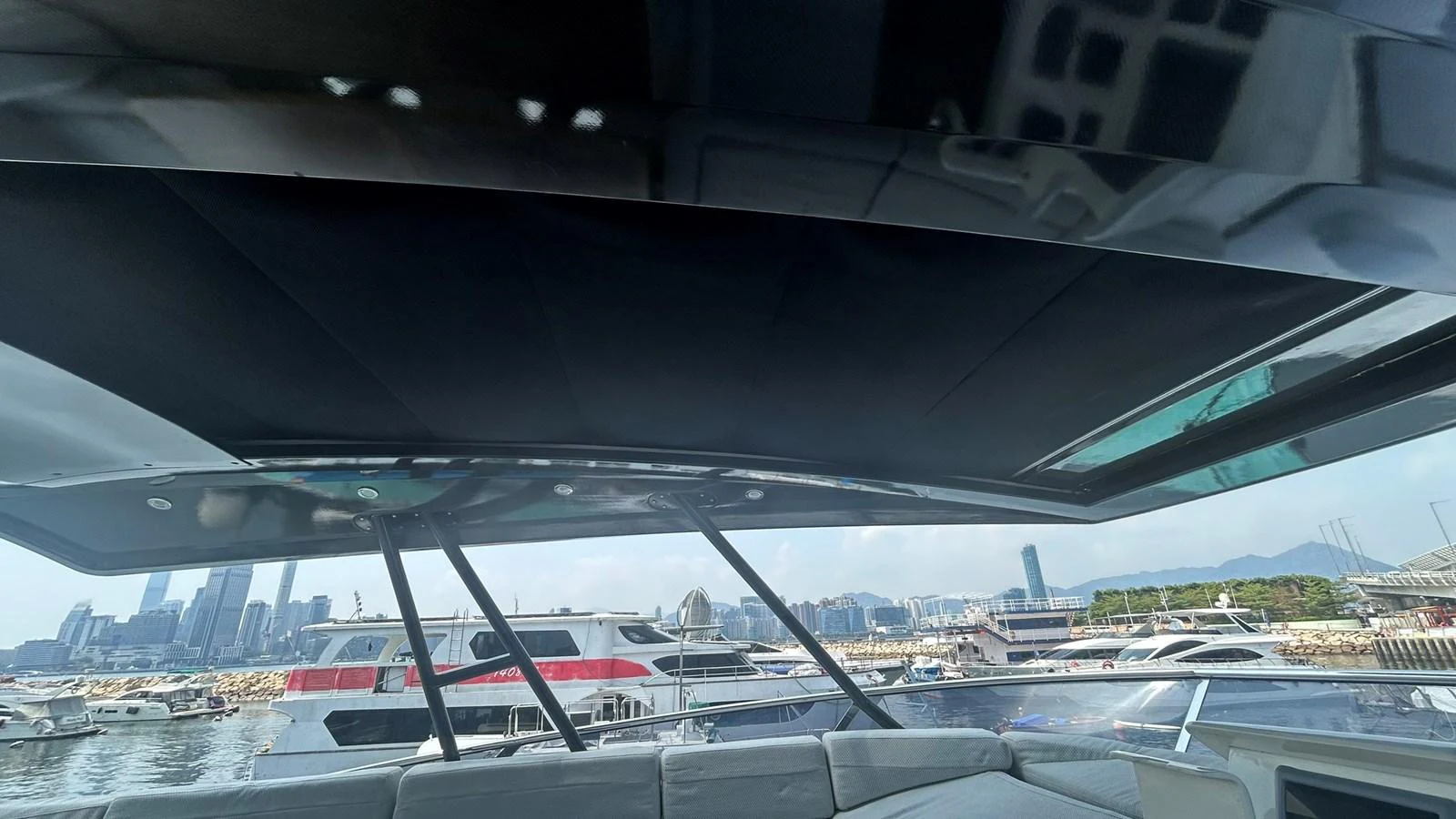 The flybridge offers a panoramic view of the marina and city skyline. aboard AURORA Yacht for Sale