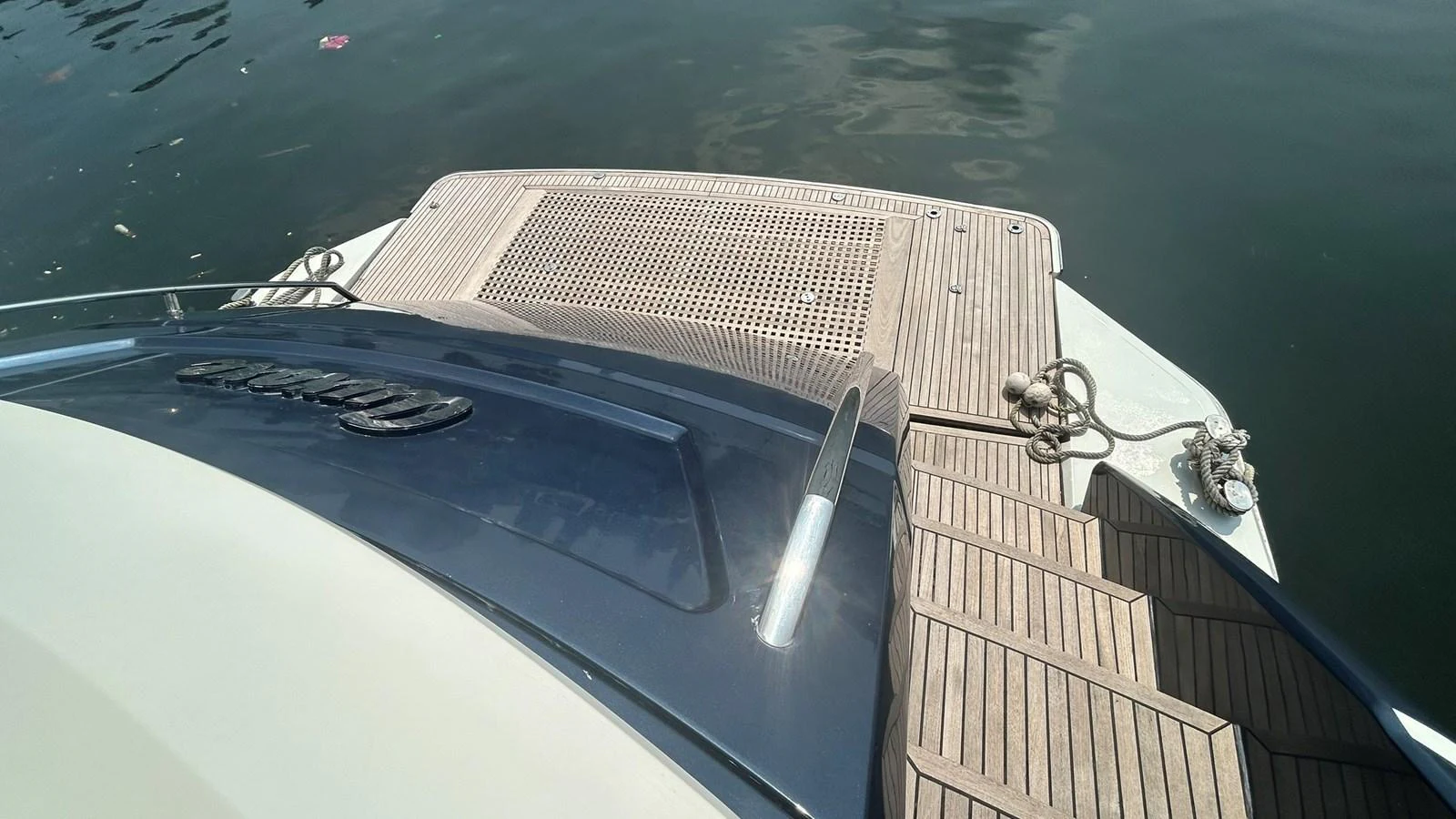 The image showcases the yacht's swim platform and part of the deck, highlighting the craftsmanship and materials used. aboard AURORA Yacht for Sale