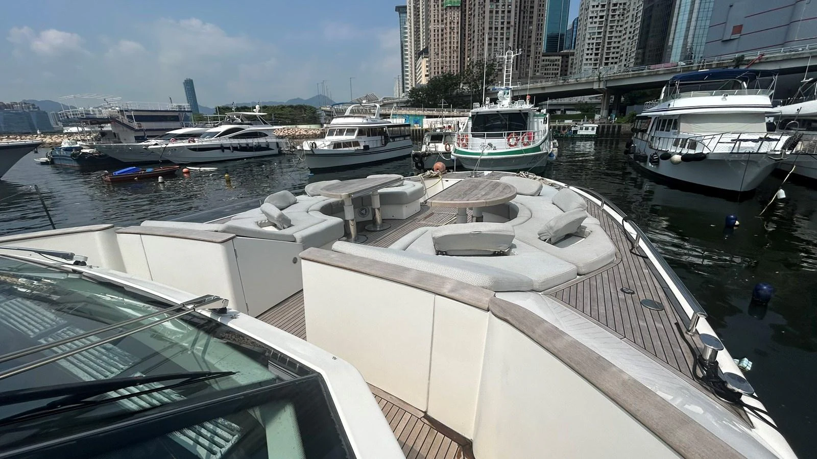 The yacht's foredeck features a spacious and luxurious lounging area with ample seating and a central table, perfect for relaxation and socializing. aboard AURORA Yacht for Sale