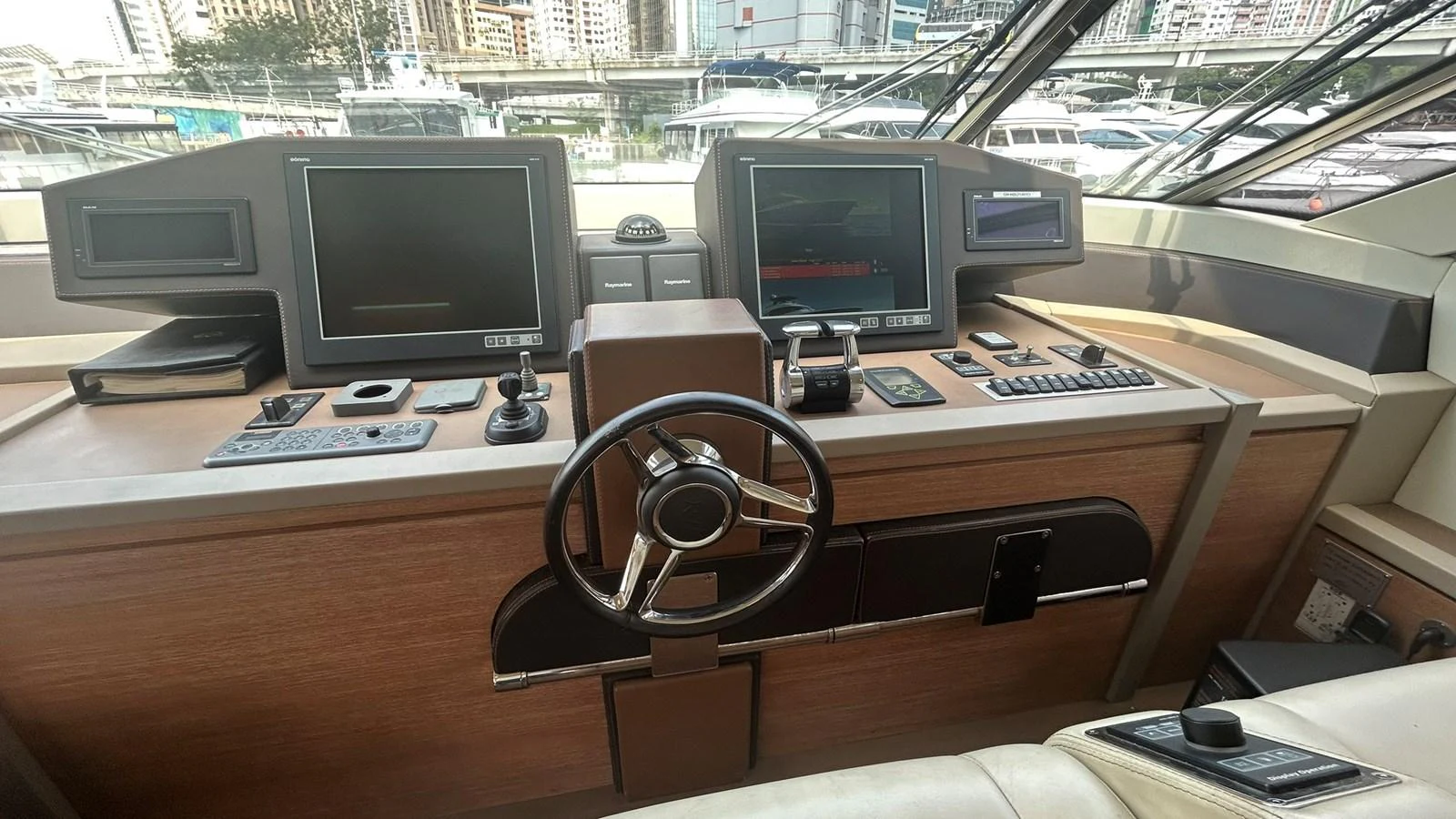 The helm station features advanced navigation equipment and a sleek design. aboard AURORA Yacht for Sale