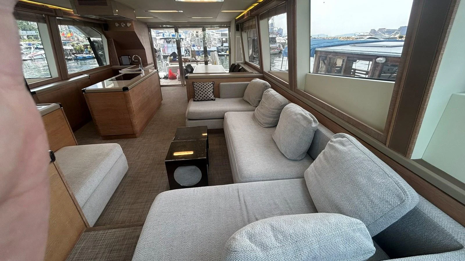 The yacht's salon features a spacious and comfortable seating area with large windows offering panoramic views. aboard AURORA Yacht for Sale
