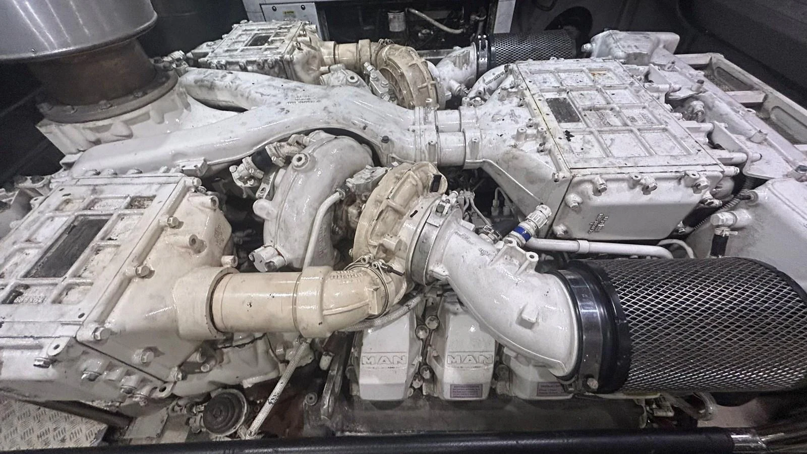 The image showcases the intricate details of the yacht's powerful engine room. aboard AURORA Yacht for Sale