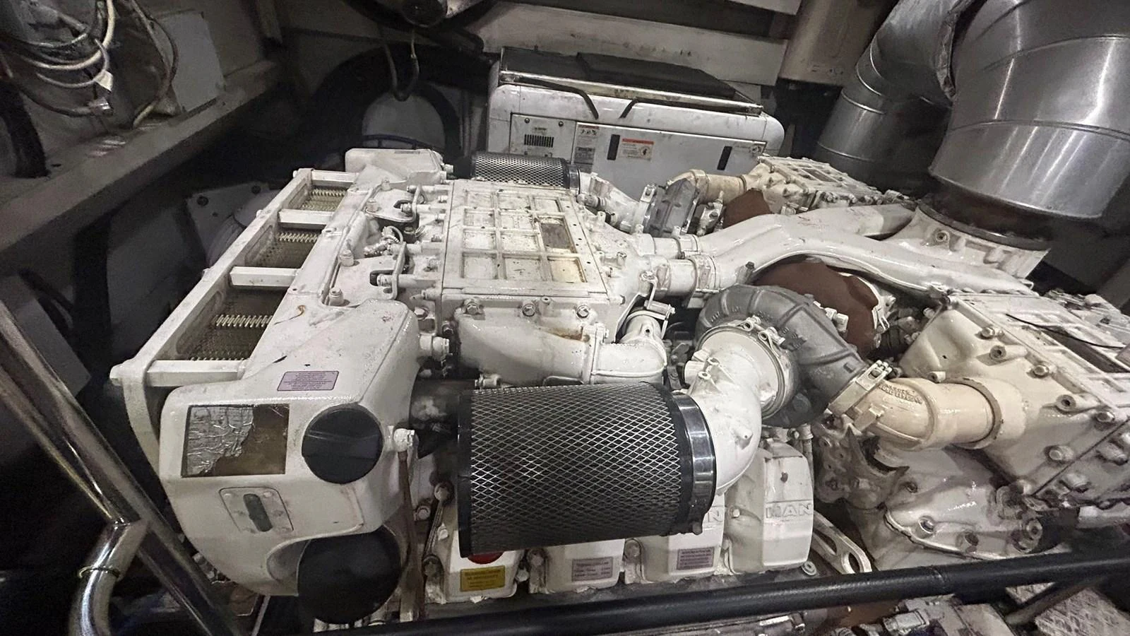 The image showcases the intricate details of the yacht's powerful engine room. aboard AURORA Yacht for Sale