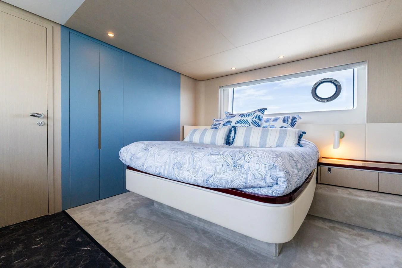 A luxurious stateroom featuring a comfortable bed and modern decor. aboard GONE PHISHING Yacht for Sale